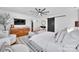 Stylish main bedroom featuring a sliding barn door, hardwood floors, area rug, and a vanity at 8136 Energy Ln, Catawba, NC 28609