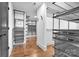 Well-organized walk-in closet with custom shelving, hardwood floors, and plenty of storage space at 8136 Energy Ln, Catawba, NC 28609