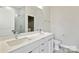 Bright bathroom featuring a double sink vanity with elegant fixtures and tile flooring at 834 Van Every St, Charlotte, NC 28205