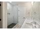 Modern bathroom featuring double sink vanity, glass shower, and stylish fixtures at 834 Van Every St, Charlotte, NC 28205