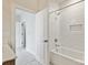 Bright bathroom features a bathtub and shower with white subway tiles and a built-in niche at 834 Van Every St, Charlotte, NC 28205