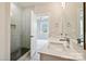 Modern bathroom featuring double sink vanity, glass shower, and stylish fixtures at 834 Van Every St, Charlotte, NC 28205