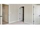Carpeted bedroom showcasing multiple doors for convenience at 834 Van Every St, Charlotte, NC 28205