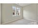 Cozy bedroom with carpet, neutral colors and great light at 834 Van Every St, Charlotte, NC 28205
