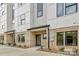 Modern townhome featuring a stylish brick facade with a gray and white color scheme at 834 Van Every St, Charlotte, NC 28205