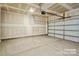 Spacious garage with overhead lighting and a white garage door provides ample parking and storage at 834 Van Every St, Charlotte, NC 28205