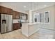 Bright kitchen features stainless steel appliances, modern cabinetry, and an island with pendant lighting at 834 Van Every St, Charlotte, NC 28205