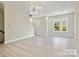 Large living room featuring hardwood flooring, natural light, and modern design elements at 834 Van Every St, Charlotte, NC 28205