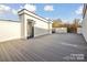 Large rooftop deck with wood-look flooring, framed by white walls, offers great outdoor living space at 834 Van Every St, Charlotte, NC 28205