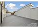 Large rooftop deck with wood-look flooring and white walls offers outdoor living with neighborhood views at 834 Van Every St, Charlotte, NC 28205