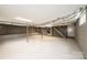 A finished basement featuring concrete walls, drop ceilings and stairs to the main floor at 975 22Nd Street Ne Pl, Hickory, NC 28601