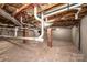 Unfinished basement showcasing exposed ceiling pipes, perfect for customization and future expansion at 975 22Nd Street Ne Pl, Hickory, NC 28601