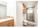 Updated bathroom features marble countertop vanity and glass shower at 975 22Nd Street Ne Pl, Hickory, NC 28601