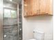 Updated bathroom features glass shower with tiled walls and hardwood cabinets at 975 22Nd Street Ne Pl, Hickory, NC 28601