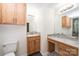 Vanity with marble countertops and tiled floors in updated bathroom at 975 22Nd Street Ne Pl, Hickory, NC 28601