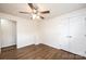 Bedroom with hardwood floors, ceiling fan, and dual door closet at 975 22Nd Street Ne Pl, Hickory, NC 28601