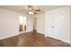 Bedroom features hardwood floors, ceiling fan, closet doors and adjoins bathroom at 975 22Nd Street Ne Pl, Hickory, NC 28601