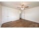 A spacious bedroom with a ceiling fan and a large closet, offering ample storage at 975 22Nd Street Ne Pl, Hickory, NC 28601