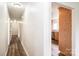 Hallway leads to kitchen and bedroom areas with hardwood flooring at 975 22Nd Street Ne Pl, Hickory, NC 28601