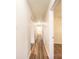 Long hallway with hardwood floors leading to bedroom at 975 22Nd Street Ne Pl, Hickory, NC 28601