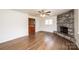 Cozy living room features a stone fireplace, wood floors, and classic built-ins at 975 22Nd Street Ne Pl, Hickory, NC 28601