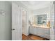 Bathroom featuring a vanity with Hollywood lighting and an adjoining glass door shower stall at 119 Mary Louise Ct, Fort Mill, SC 29715