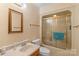 Cozy bathroom featuring a bathtub with sliding doors and a classic vanity at 119 Mary Louise Ct, Fort Mill, SC 29715