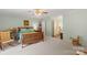 Spacious bedroom with a wooden bed, and view to the bathroom and living room at 119 Mary Louise Ct, Fort Mill, SC 29715