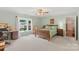 Bright bedroom with a wooden bed, window, desk, and fan at 119 Mary Louise Ct, Fort Mill, SC 29715