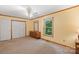 Bedroom featuring large closets, a window, and neutral decor at 119 Mary Louise Ct, Fort Mill, SC 29715