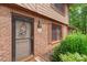 Charming entryway with a decorative door, brick facade, and manicured landscaping enhances curb appeal at 119 Mary Louise Ct, Fort Mill, SC 29715