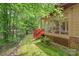 Charming home exterior with a sunroom and deck, nestled in a wooded setting at 119 Mary Louise Ct, Fort Mill, SC 29715