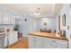 Bright eat-in kitchen featuring white cabinets, butcher block island, and stainless steel appliances at 119 Mary Louise Ct, Fort Mill, SC 29715