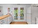 Bright kitchen featuring white cabinets, stainless appliances, and a view to sunroom at 119 Mary Louise Ct, Fort Mill, SC 29715