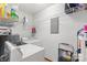 Laundry room with washer, dryer, wire shelving, and step ladder at 119 Mary Louise Ct, Fort Mill, SC 29715