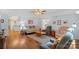 Spacious living room with hardwood floors, ceiling fan, and comfortable seating area at 119 Mary Louise Ct, Fort Mill, SC 29715