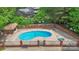 Aerial view of a fenced community pool, ideal for summer recreation at 119 Mary Louise Ct, Fort Mill, SC 29715