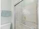 Shower featuring grab bars, soap niche, glass door and modern fixtures at 119 Mary Louise Ct, Fort Mill, SC 29715