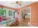 Sunroom with table, chairs, and door to porch; also view into the kitchen at 119 Mary Louise Ct, Fort Mill, SC 29715