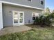 Backyard view featuring a patio and double doors with view of some grass at 12120 Stratfield Place Cir, Pineville, NC 28134