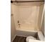 Bathroom featuring a white tub with shower combo and coordinating toilet at 12120 Stratfield Place Cir, Pineville, NC 28134