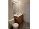 Bathroom featuring a single sink vanity with storage, and a large mirror at 12120 Stratfield Place Cir, Pineville, NC 28134