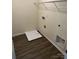 Functional laundry room with vinyl flooring, washer and dryer hookups, and storage at 12120 Stratfield Place Cir, Pineville, NC 28134