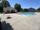 Community pool with clear water, surrounded by lounge area and shaded pavilion at 12120 Stratfield Place Cir, Pineville, NC 28134