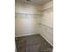 Walk-in closet with shelving for storage and plush neutral carpeting at 12120 Stratfield Place Cir, Pineville, NC 28134