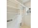 Bright laundry area with white cabinetry, utility sink hookups, and natural light from the window at 205 Coxe Ave, Charlotte, NC 28208