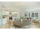 Open-concept living area with a stylish kitchen, dining space, and comfortable seating area with great natural light at 205 Coxe Ave, Charlotte, NC 28208