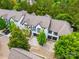 Stunning aerial view of a luxury home with lush landscaping, a private driveway, and a serene setting at 208 Wendover Heights Cir, Charlotte, NC 28211