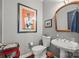 Charming half-bathroom features elegant vanity and stylish artwork at 208 Wendover Heights Cir, Charlotte, NC 28211