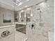 Modern bathroom with double vanity, glass-enclosed shower, and marble accents at 208 Wendover Heights Cir, Charlotte, NC 28211